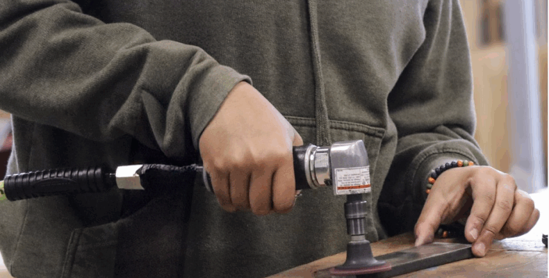 A team member practice with a tool